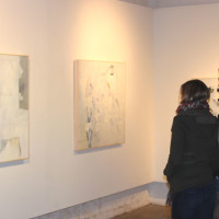 couple gallery looking at art